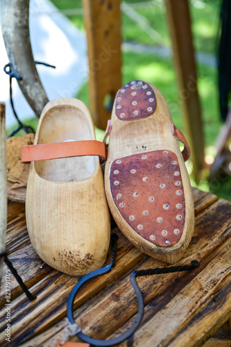 Vintage wooden shoes, peasant shoes, Dutch wooden shoes with leather straps, clogs