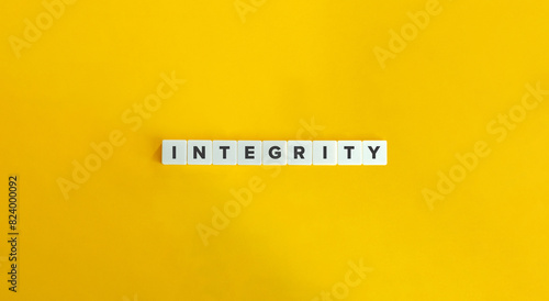 Integrity Word. Concept of Upholding strong moral principles and being consistent in actions and values. Text on Block Letter Tiles on Yellow Background. Minimalist Aesthetics.