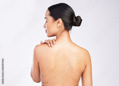 Studio, woman and bare back with skincare or wellness isolated on white background with glowing skin. Hydration, hands and dermatology with healthy body for shine with natural treatment in Sweden.