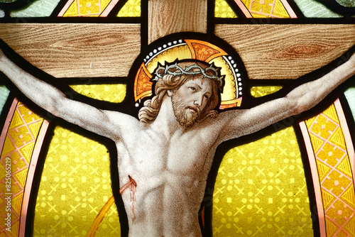 A stained glass of Jesus on cross. Sanctuary Notre-Dame de La Salette, France. Vitrail de Jésus sur la croix avec le sang sortant de son coeur ouvert. Sanctuaire de Notre-Dame de La Salette