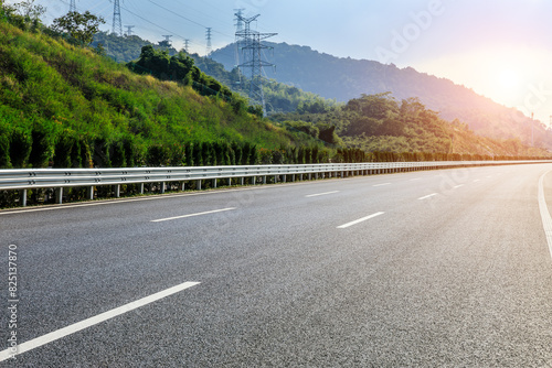 Asphalt highway road and green mountain natural background