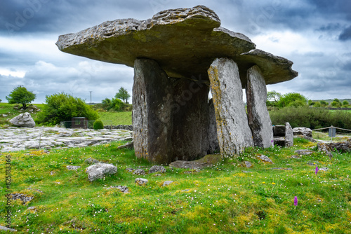 Poulnabrone dolmen in Burren geopark, Ireland, with dramatic cloud sky