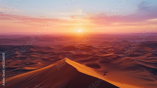Stunning desert landscape with golden sand dunes at sunrise, creating a serene and majestic atmosphere.