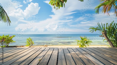 Wooden deck with a beautiful sea and sky background, overlooking the beach and ocean. This tropical wooden deck is situated at the seafront by the beach.