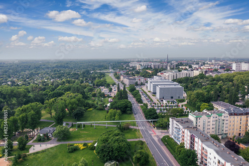 Summer skyline cityscape of Dolna Wilda district in Poznań, Poland. Wide panoramic aerial view. Park im. Św. Jana Pawła II and City tax office building (Urząd Skarbowy).