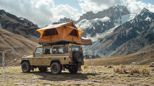A rugged SUV with a rooftop tent is parked in a vast, mountainous landscape under a cloudy sky.