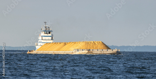 A tug pushing a barge of sand up the Chesapeake Bay.