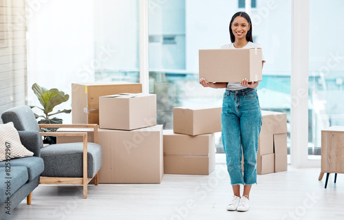 Woman, portrait and moving to new home with boxes for real estate investment, immigration or apartment. Female person, smile and property owner or growth milestone with packing, mortgage or goals