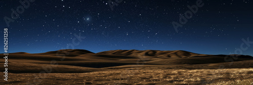 A starry night sky with a large hill in the background