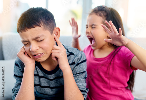 Siblings, screaming and angry with fight in home for conflict, problem and frustrated on sofa. Boy, finger in ears and girl with tantrum in living room for dispute, upset and shouting in argument