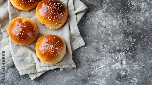 delicious buns on linen napkin and grey concrete background food photography