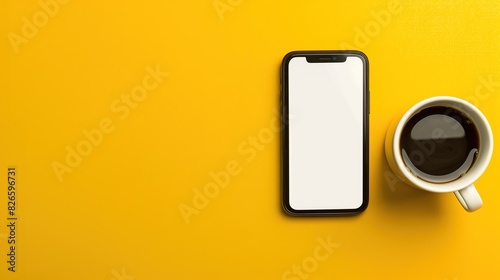 A digital photo of a smartphone with a blank white screen and a cup of coffee on a bright yellow solid color background
