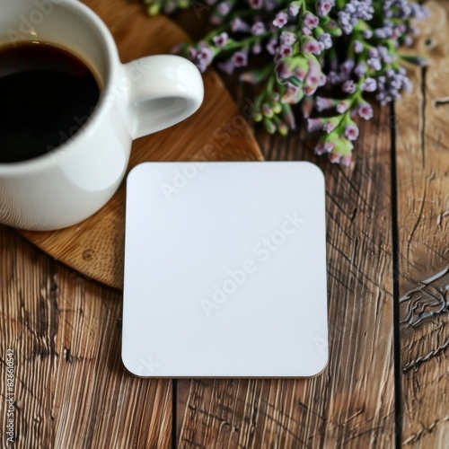 Simple white coaster on a blank surface, ideal for custom artwork or logos