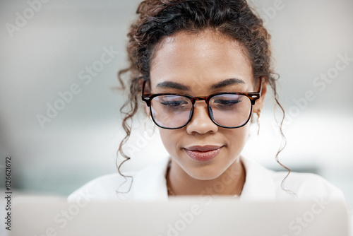 Business, woman and glasses with laptop for work with media, journalism for print or newspaper. Female journalist, computer and research for career with blog on lifestyle events, article for magazine