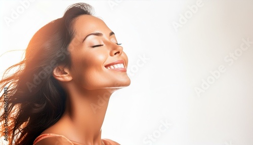 A women eyes closed, face turned upwards, basking in a moment of pure bliss.