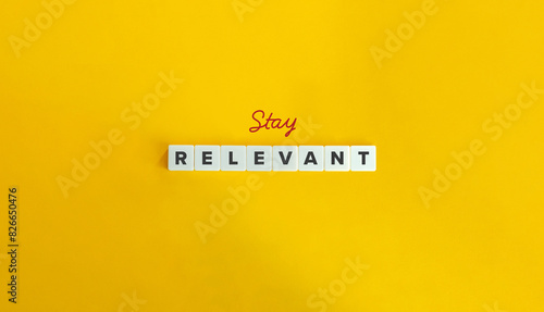 Stay Relevant Phrase and Banner. Concept of continuously adapt, update, and evolve in order to maintain significance, importance, or usefulness. Text on Block Letter Tiles on Flat Background.