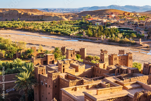 View of Ksar Ait Ben Haddou, old Berber ancient village or kasbah with desert in background, Ouarzazate, Morocco, North Africa