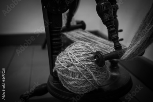 yarn threads on spinning-wheel