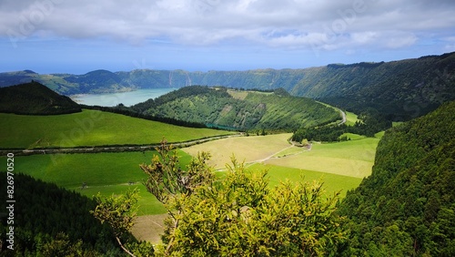 kes in a volcanic crater, green meadows and forests, fantastic natural scenery. The Azores.