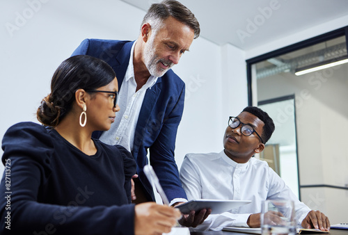 Business people, meeting and mentor with tablet in office for teamwork, feedback or planning project together. Coaching, diversity and employees for collaboration, review proposal or development team