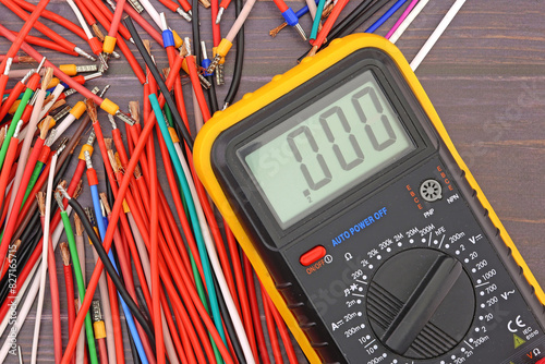 A digital multimeter for measuring the parameters of electrical circuits in an electrical diagram. Close-up.