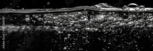 Water Bubbles in a Black Background,Bubbles rising through water with light reflections in a mesmerizing underwater scene