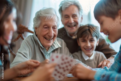 A joyful family moment as they play cards with a cheerful elderly man, invoking feelings of togetherness and fun