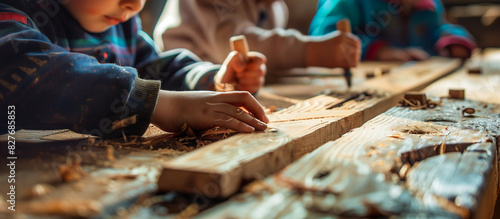 kids in a carpentry workshop doing engrave wooden floral pattern
