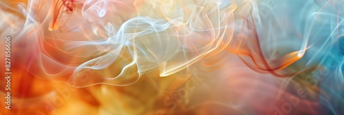 Blurry colorful background with swirling incense smoke in warm tones and soft focus