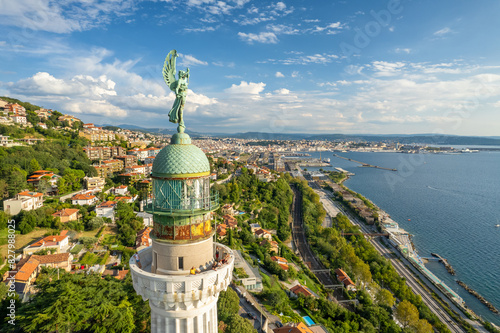 Faro della Vittoria lighthouse in Trieste city at sunny day, Italy