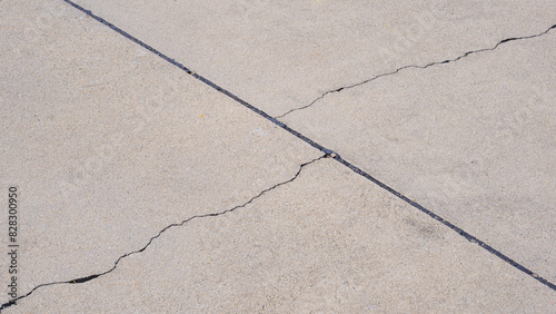 Two crack lines texture on surface of concrete pavement floor background