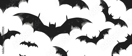 A black and white image of bats flying in the sky