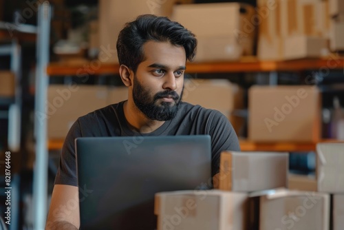 Indian male entrepreneur sells online focuses on e commerce and delivery.