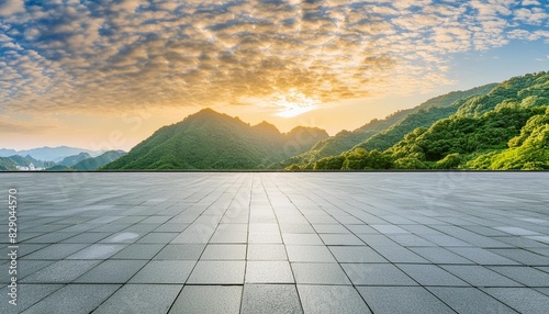 empty square floor and green mountain with sky clouds at sunset panoramic view