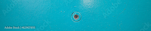 door peephole embedded in the door close-up with a beautiful texture of the painted entrance group