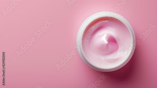 a luxurious hydrating face cream in a sleek white jar against a vibrant pink background. The smooth and creamy texture of the cream is highlighted, making it ideal for skincare product promotions.