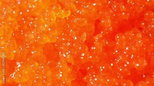 Tobiko boasts a mild, slightly salty flavor evoking the sea. Versatile, it enhances dish flavor without overpowering other ingredients. Shot with 24mm probe macro lens. Food background. 
