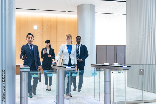 Group of multinational business people passing through a security gate