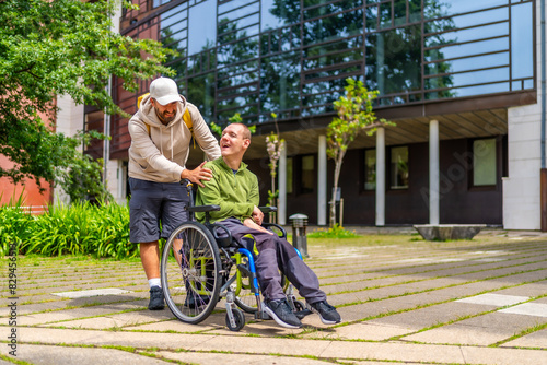 Man with special needs and friend walking along university campus