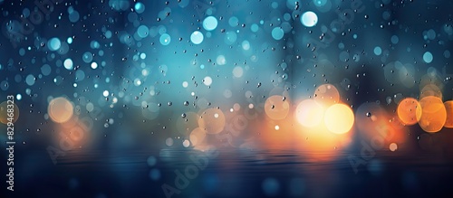 An abstract copy space image depicting a rainy night background illuminated with bokeh effects