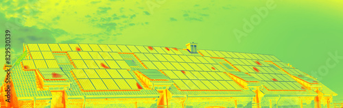 Thermographic inspection of photovoltaic systems on a roof by the house. Thermovision image of solar panels. Infrared thermovision image. Infrared thermography in inspection of photovoltaic panels. 