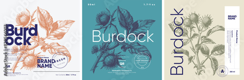 A set of three botanical product labels depicting the burdock plant, each executed in an engraving style with detailed illustrations, presented in blue and beige tones.