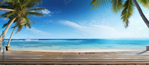 A tranquil beach scene on a sunny day with palm trees and a wooden walkway ideal for a horizontal banner with copy space image