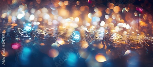 A soft focus background of sparkling lights in a pool suitable for text or graphics with copy space image available