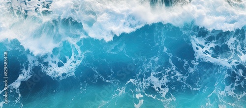 An impressive aerial photo showing ocean waves crashing in deep waters ideal for backgrounds A drone s bird s eye perspective captures the dynamic seascape in this captivating copy space image