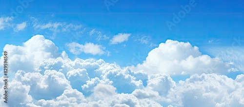 Cumulus clouds floating in a blue sky captured by a Designer Photography to present a stunning copy space image