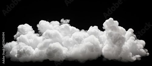 White clouds set against a black backdrop with copy space image