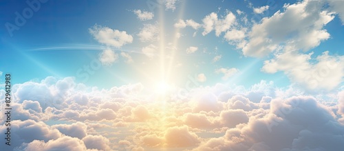 The sunlight created a beautiful backdrop with a copy space image behind a fluffy cloud in the sky