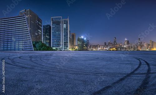 Asphalt road square and modern city buildings at night in Chongqing. Panoramic view.