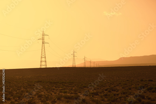 Electric power poles in southern Morocco desert